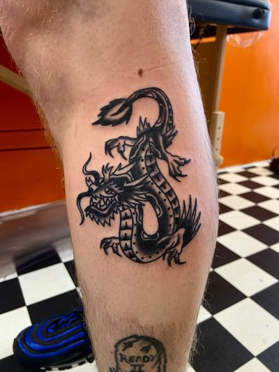 Get a fierce and mythical traditional dragon tattoo by the talented artist Flashbyaj. Bring a piece of ancient folklore to life on your skin.