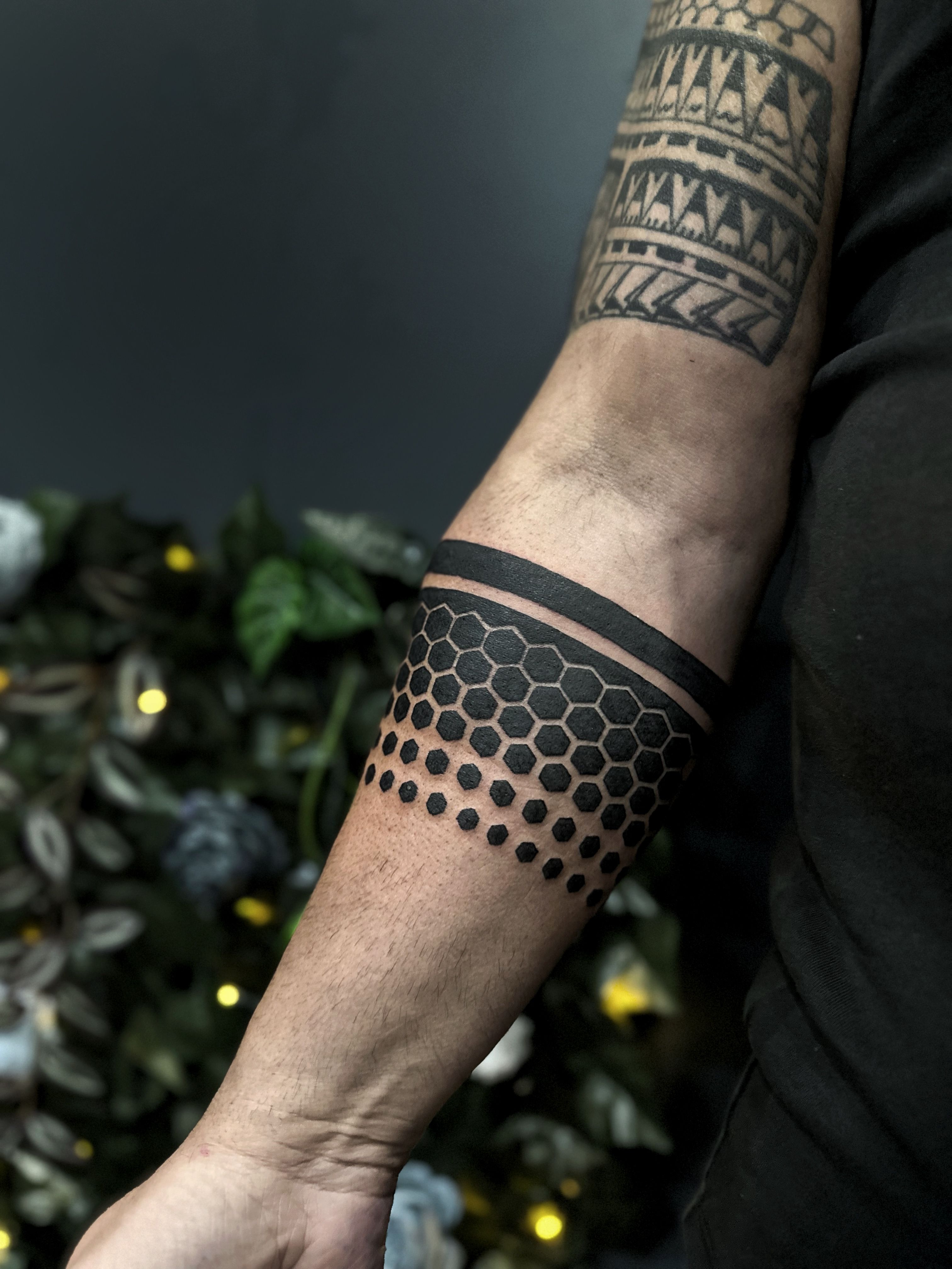 Polygon style pineapple tattoo on the inner arm.