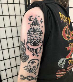 Get inked with a stunning traditional castle design by the talented artist Goblyn Crew. Explore the magic of ancient architecture with this unique tattoo.