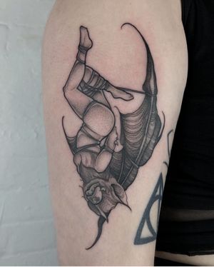 Unique illustrative tattoo featuring a bat, woman, and BDSM elements, by artist Claudia Smith.