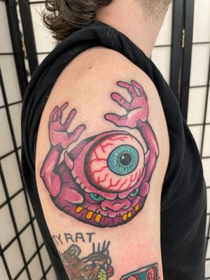 Get inked with a fierce monster eye design by the talented Goblyn Crew. Perfect blend of illustrative and traditional styles.