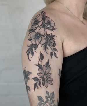 Get a stunning illustrative flower tattoo designed by the talented artist Claudia Smith. Perfect for nature lovers!