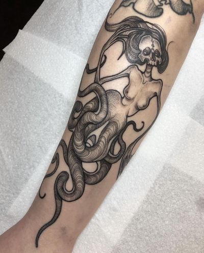 Get a unique illustrative horror tattoo featuring a monstrous creature, expertly designed by talented artist Claudia Smith. Embrace the spooky side of tattoo art!