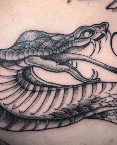 Explore the beauty of this illustrative snake tattoo designed by the talented artist Claudia Smith. Perfect for snake lovers!
