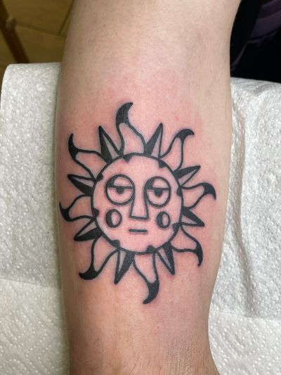 Embrace the bold and unique with this illustrative sun tattoo by Goblyn Crew. Stand out from the crowd with this one-of-a-kind design.