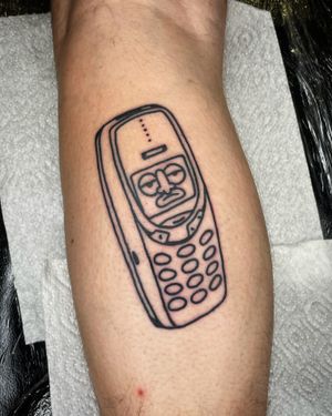 Get a nostalgic ink of the iconic Nokia 3320 phone in an ignorant style by the talented artist Goblyn Crew.
