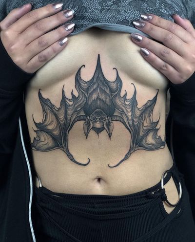 Get a spooky illustrative tattoo of a bat in a horror motif by the talented artist Claudia Smith. Perfect for fans of the macabre!