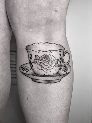 Beautifully detailed fine line illustration of a rose and tea cup by the talented artist tattsbybetts.