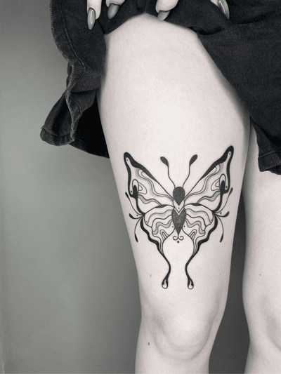 Unique illustrative tattoo design of an abstract butterfly by talented artist tattsbybetts.