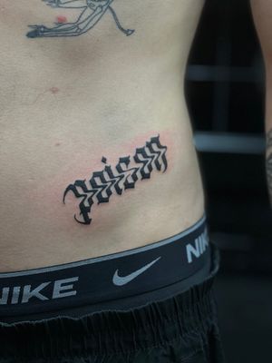 Get a toxic twist with Misa's poison-themed lettering tattoo. Unique and edgy design for bold statement makers.