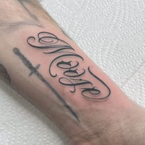 Express your individuality with a custom lettering tattoo by DVA. Get personalized and unique ink that speaks volumes about you.
