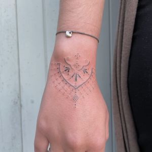Delicate and beautiful design by DVA, perfect for those who appreciate detailed tattoos.
