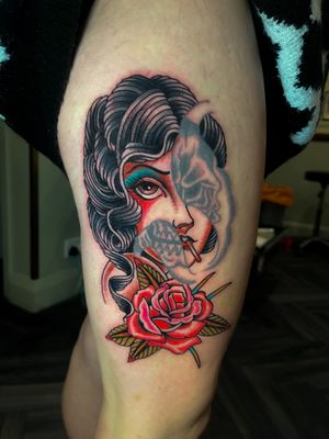 Get a unique illustrative traditional tattoo of a skull combined with a woman, expertly done by artist Barney Coles.