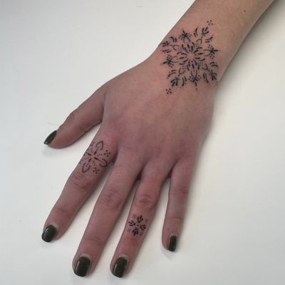 Discover the beauty of delicate ornamental tattoo designs by the talented artist DVA. Unique and mesmerizing patterns to adorn your skin.