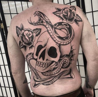 Embrace the classic artistry of traditional tattooing with this striking design featuring a snake, rose, and skull. Expertly executed by the talented artist Sam Waiting.