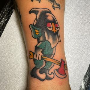 Get a bold traditional goblin tattoo by the talented Goblyn Crew. Embrace the mystical and mischievous with this unique design.