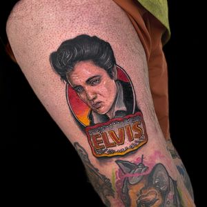 Capture the essence of the King of Rock 'n Roll with this stunning and lifelike portrait tattoo by the talented artist Jethro Wood.