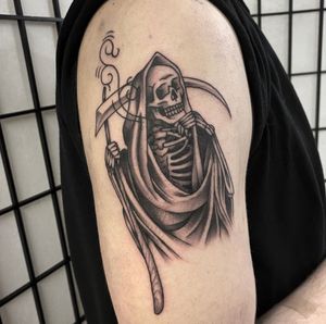 Embrace the mystery of the afterlife with this striking black and gray traditional Grim Reaper tattoo by the talented artist Sam Waiting.