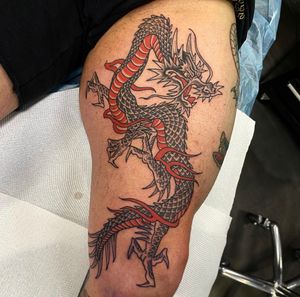 Embrace the power and wisdom of the legendary dragon with this dynamic and intricately designed Japanese style tattoo by renowned artist Sam Waiting.