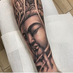 Elegant black & gray tattoo of Buddha, expertly crafted by Sam Waiting with intricate detailing.