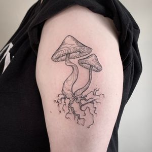 Flash illustrative linework mushrooms on the arm