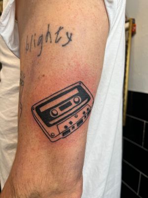 Get a nostalgic vibe with this detailed tattoo by Claudia Vicente. Perfect for music lovers.