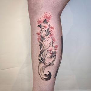 Custom dark illustrative decaying fox with red spider lilies on calf