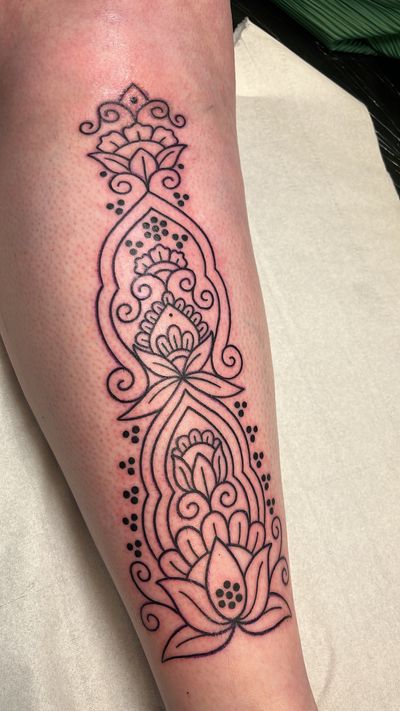 Experience the beauty of ornamental and illustrative styles combined in this stunning lotus and mandala design by the talented artist Claudia Vicente.