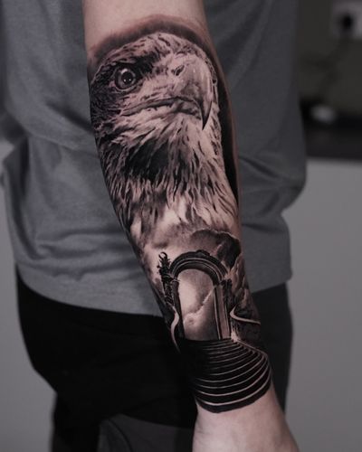 Ascend to the heavens with this stunning black and gray tattoo featuring an eagle soaring towards a stairway and door to paradise, beautifully crafted by Milan Boros.