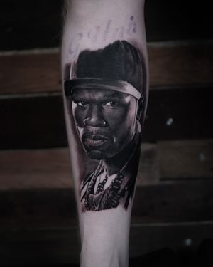 Capture the iconic rapper in stunning black and gray realism with this portrait tattoo by artist Milan Boros.