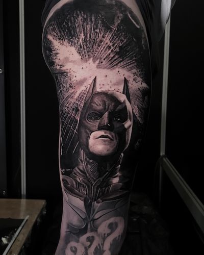 Get a stunning black and gray realism tattoo of Batman from The Dark Knight Rises by the talented artist Milan Boros.