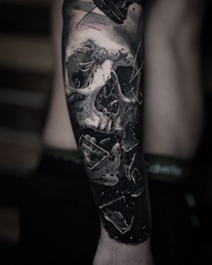 Get a stunning black and gray skull tattoo design by the talented artist Milan Boros for a timeless and bold look.
