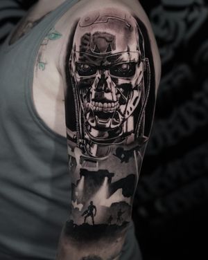 Get a realistic black and gray tattoo of the iconic terminator robot design by talented artist Milan Boros.