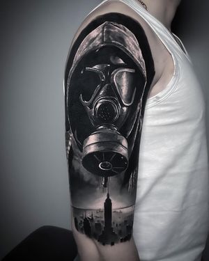 Get a stunning black and gray gas mask tattoo done with expert precision by artist Milan Boros.