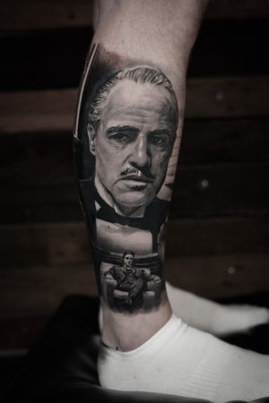 Captivating black and gray tattoo of Marlon Brando as Vito Corleone, expertly done by Milan Boros.