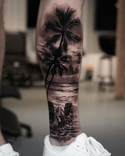 Capture the serenity of beach life with this stunning black and gray palm tree tattoo by Milan Boros. Bring a piece of paradise to your skin.