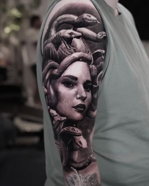 Experience the mythical beauty of Medusa with this stunning black and gray realism tattoo by Milan Boros.