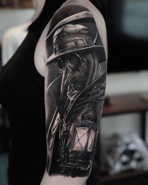 Experience the eerie beauty of a black and gray plague doctor tattoo by the talented artist Milan Boros.