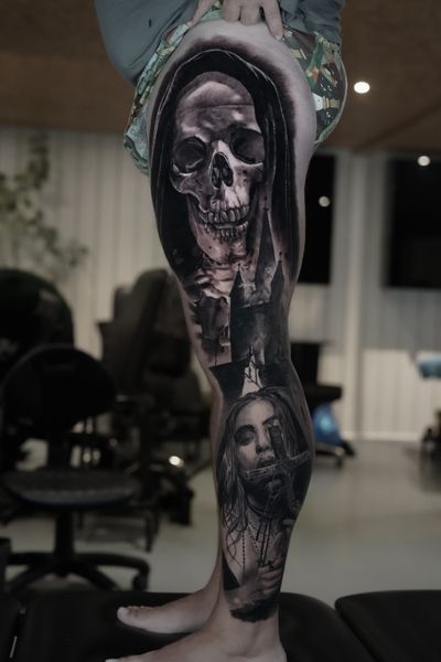 Experience the haunting beauty of Milan Boros' stunning black and gray tattoo featuring a skull, grim reaper, castle, and woman in exquisite realism.