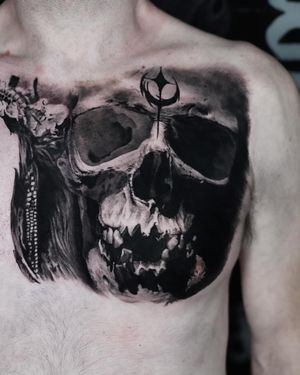 This black and gray tattoo by Milan Boros features a stunningly detailed skull design, perfect for those who appreciate realism in their ink.