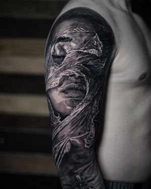 Get a stunning black and gray tattoo of a woman with a plastic motif by the talented artist Milan Boros.