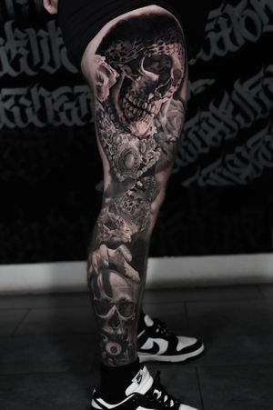 Stunning black and gray realism tattoo by Milan Boros featuring a combination of butterfly, skull, and jewelry motifs. Exquisite detail and depth in this unique design.