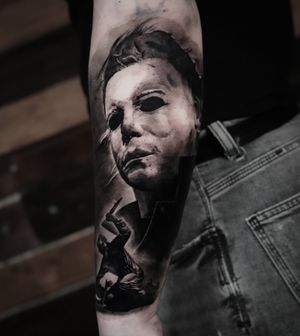 Get spooked with this realistic black and gray tattoo of Michael Myers from Halloween by Milan Boros. Perfect for horror enthusiasts!