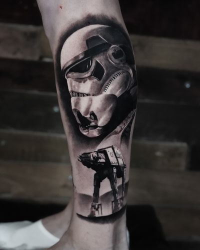 Immerse yourself in the Star Wars universe with this stunning black and gray tattoo by Milan Boros. Perfect for any fan of the Galactic Empire.