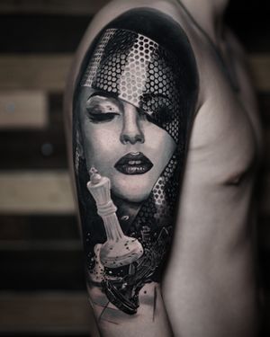 Get a stunning black and gray portrait of Madonna by the talented artist Milan Boros. Detailed and lifelike, this tattoo is sure to impress!