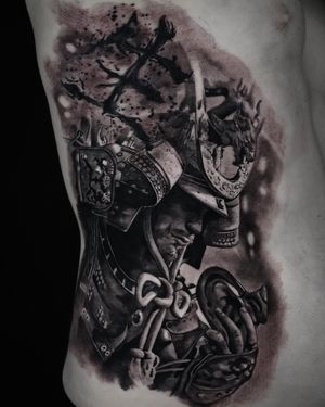 Experience the power and grace of a samurai warrior with this stunning black and gray tattoo, expertly crafted by Milan Boros.