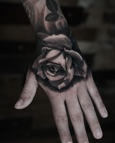 Captivating black and gray realism rose by Milan Boros, showcasing intricate details and shading.