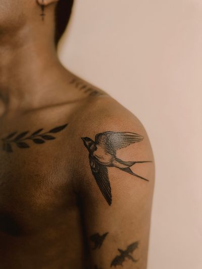 Realistic swallow, small dragons, collarbones leaves and runes