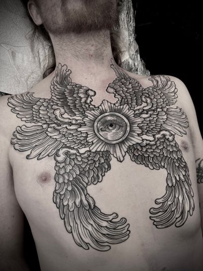 Experience the intricate beauty of an angel design with a woodcut and etch style tattoo by the talented artist Lamat.