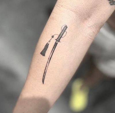 Detailed black and gray micro realism by Tom Boxell, featuring an illustrative katana sword design.